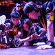 A RoboMaster team makes adjustments to a robot.